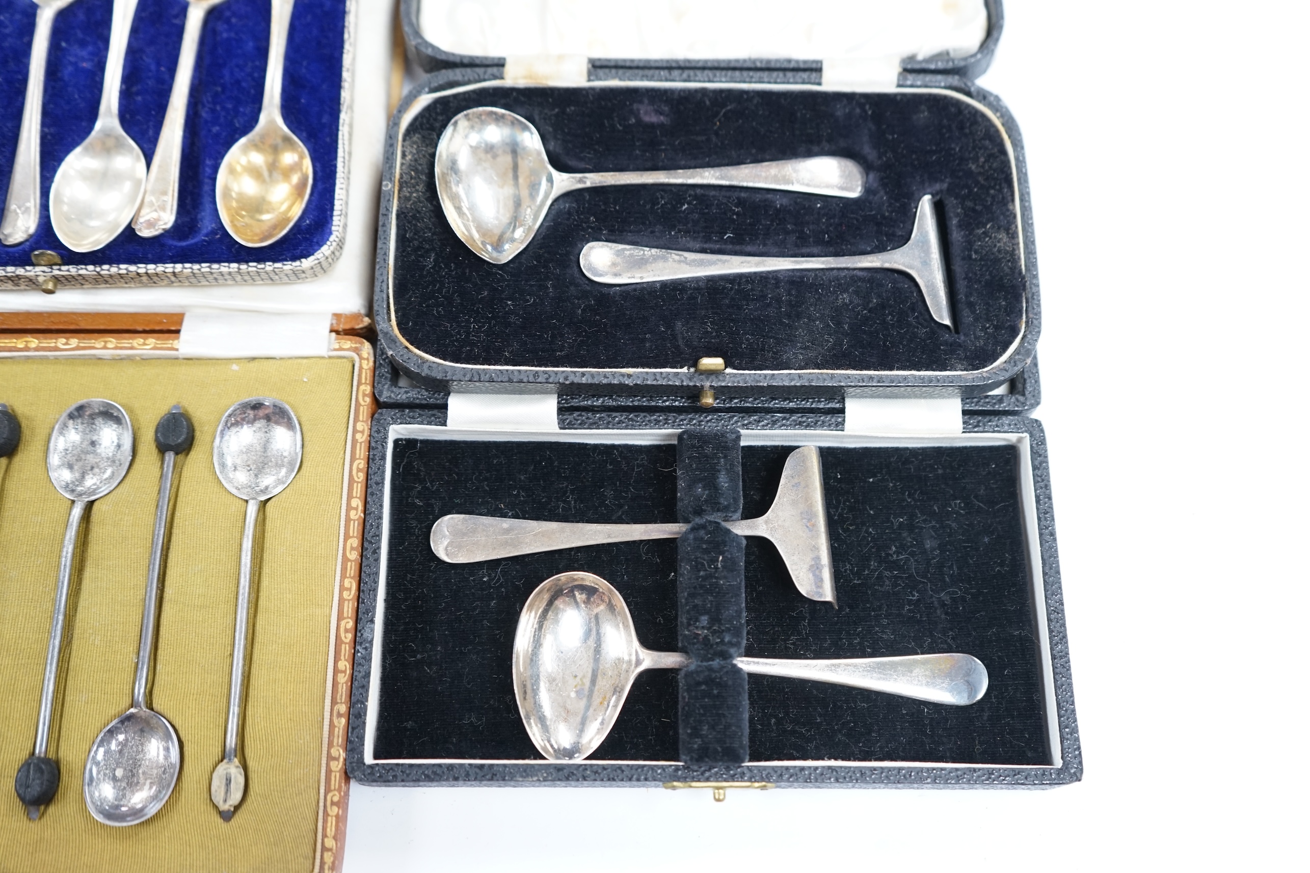 Two cased sets of six silver coffee spoons including bean end and golfing related and two cased silver christening spoons and pushers. Condition - poor to fair